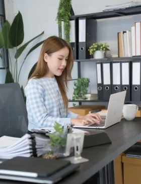 A calm woman working with better focus and daily functioning after PTSD treatment.